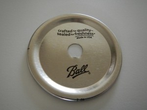 how to drill a hole in a canning jar lid to make a reusable soap dispenser